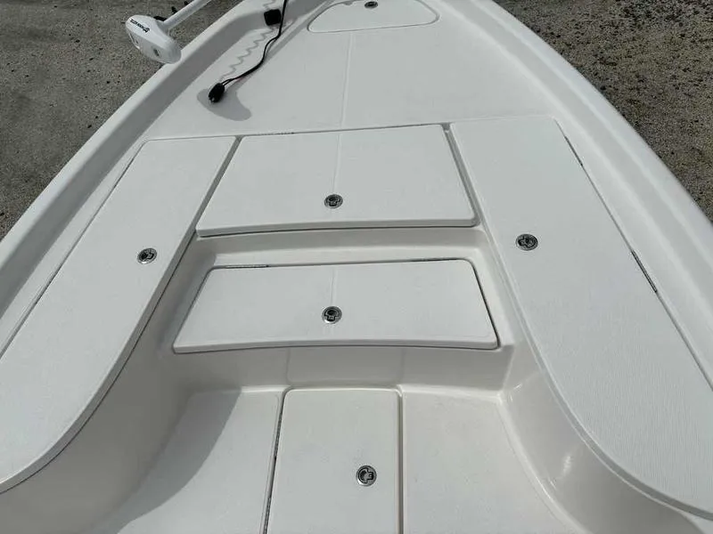 Slide: The Image of 2026 Blazer PureBay 2200 boat deck with storage compartments and trolling motor. - 14