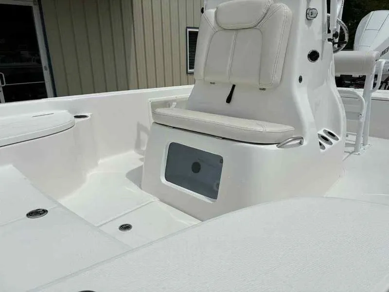 Slide: The Image of 2026 Blazer PureBay 2200 boat interior with white seating and storage compartment. - 17