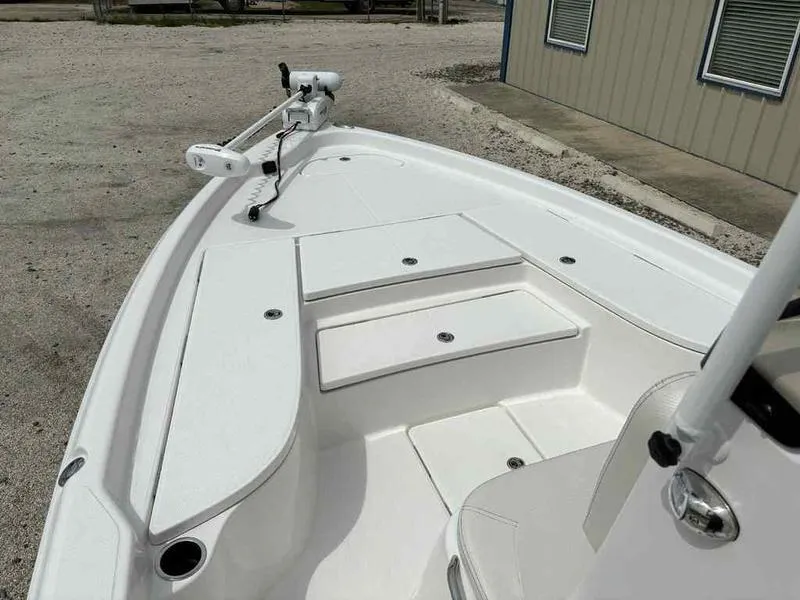 Slide: The Image of 2026 Blazer PureBay 2200 boat deck with storage compartments and trolling motor. - 20