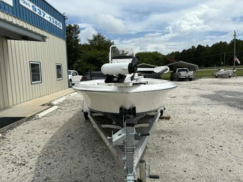 Slide: The Image of 2026 Blazer PureBay 2200 boat on trailer outside a building. - 3