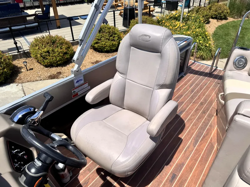 Slide: The Image of Captain's chair on 2013 Crest Classic 230SLR boat, featuring sleek design and comfortable seating. - 13