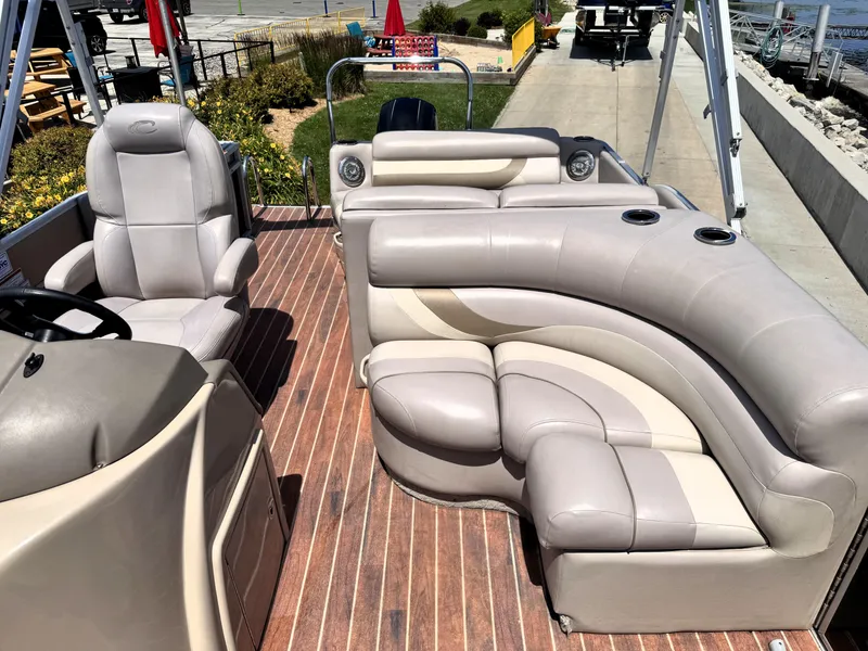 Slide: The Image of Luxurious seating on 2013 Crest Classic 230SLR pontoon boat with wood-style flooring. - 19