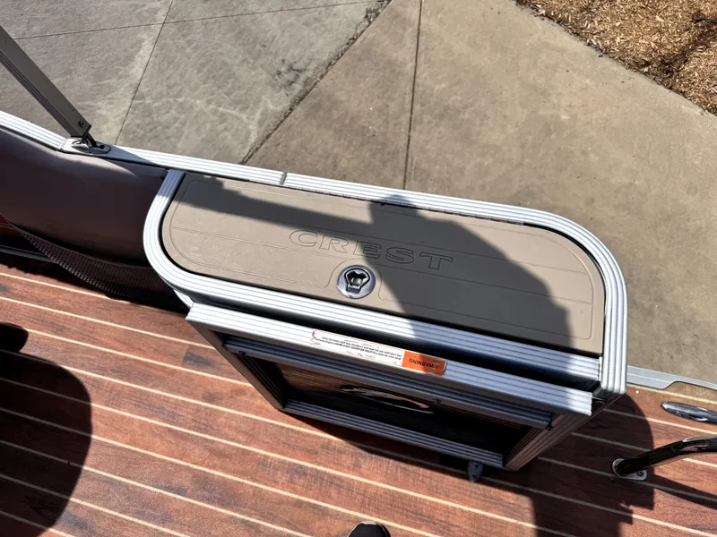 Slide: The Image of Crest Classic 230SLR 2013 boat deck with storage compartment, viewed from above. - 22