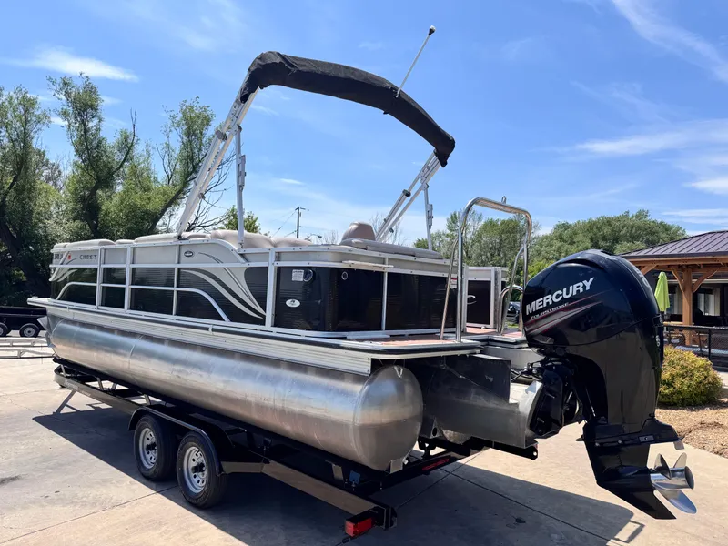 Slide: The Image of 2013 Crest Classic 230SLR pontoon boat with Mercury outboard motor on trailer. - 4