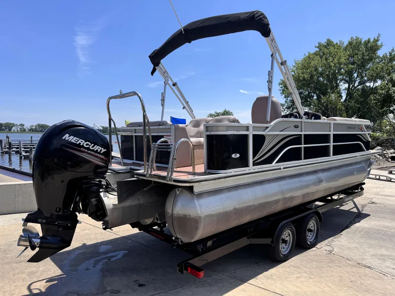 Slide: The Image of 2013 Crest Classic 230SLR pontoon boat with Mercury outboard motor on trailer. - 5