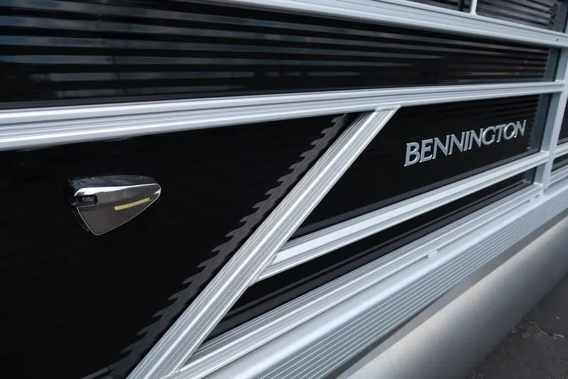 Slide: The Image of 2026 Bennington S Swingback 22 SSB boat, sleek black and silver design detail. - 12