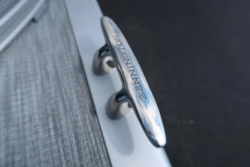 Slide: The Image of Close-up of a Bennington cleat on a 2026 S Swingback 22 SSB boat. - 14