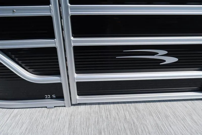 Slide: The Image of 2026 Bennington S Swingback 22 SSB pontoon boat side panel with sleek design. - 18