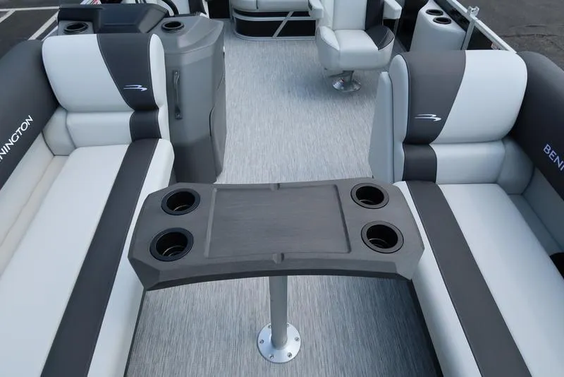 Slide: The Image of 2026 Bennington S Swingback 22 SSB interior with seating and table, featuring cup holders. - 21