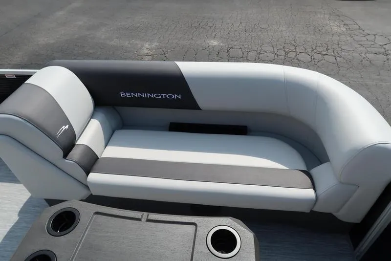 Slide: The Image of 2026 Bennington S Swingback 22 SSB boat interior with sleek seating and cup holders. - 22