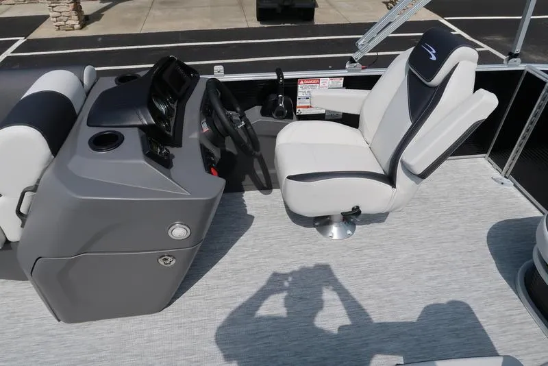 Slide: The Image of 2026 Bennington S Swingback 22 SSB boat interior with helm and captain's chair. - 26