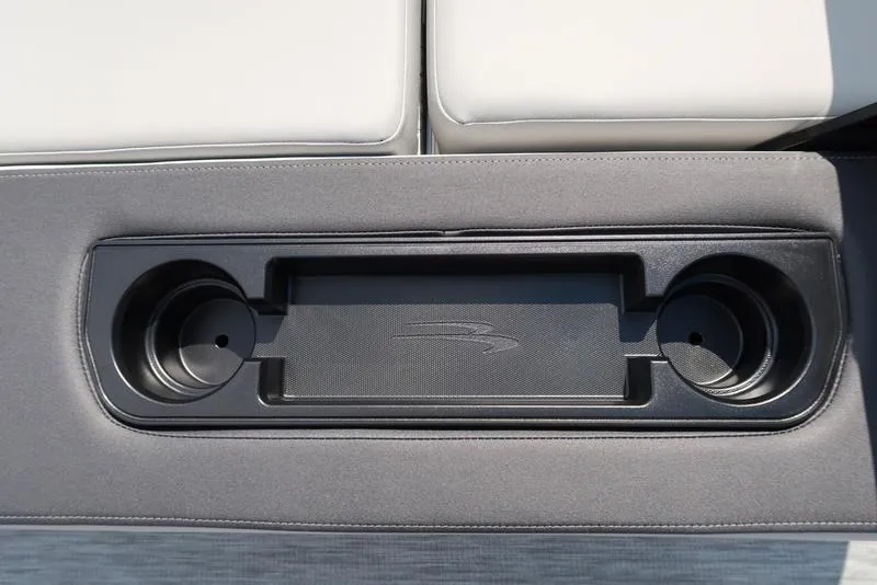 Slide: The Image of 2026 Bennington S Swingback 22 SSB cup holders and storage compartment detail. - 31
