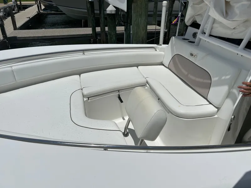 Slide: The Image of 2013 Sea Hunt Edge 24 boat interior with white cushioned seating. - 13