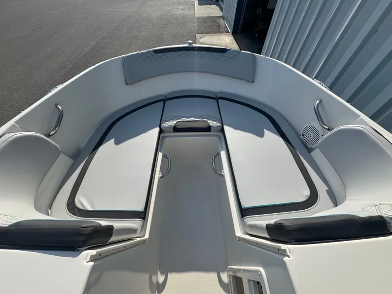Slide: The Image of 2022 Bayliner Element M17 boat interior with cushioned seating and stainless steel handles. - 1