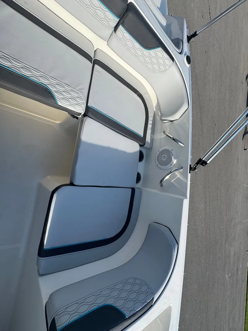 Slide: The Image of 2022 Bayliner Element M17 boat interior with cushioned seating and modern design. - 5