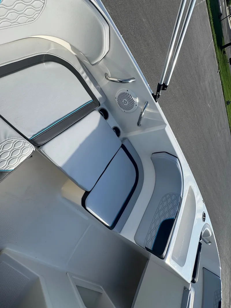 Slide: The Image of 2022 Bayliner Element M17 boat interior with cushioned seating and speaker. - 6