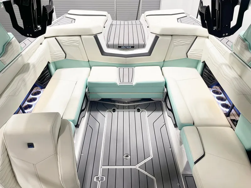 Slide: The Image of 2025 Nautique Super Air Nautique G23 interior with luxurious seating and modern design. - 4