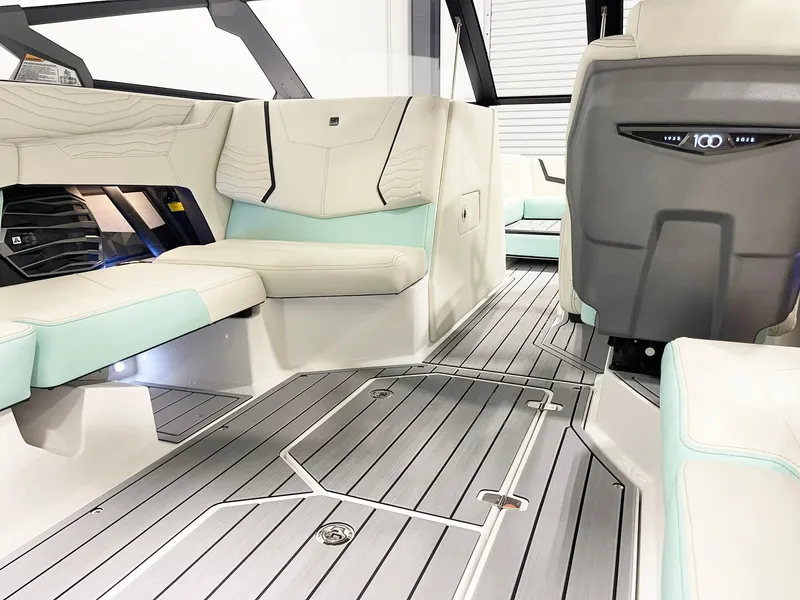 Slide: The Image of 2025 Nautique Super Air Nautique G23 interior with sleek seating and modern design. - 9