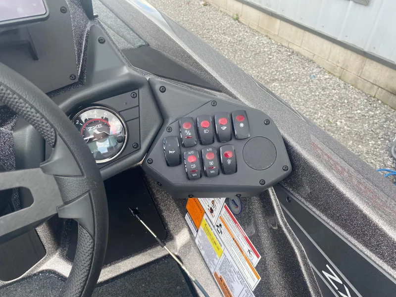 Slide: The Image of Dashboard of 2026 Skeeter ZXE 21 boat with control panel and gauges. - 10