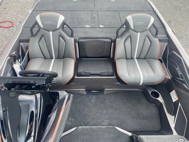 Slide: The Image of 2026 Skeeter ZXE 21 boat interior with dual gray seats and steering console. - 15