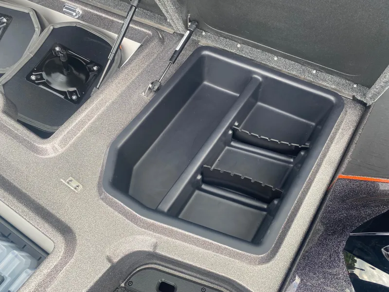 Slide: The Image of Storage compartment of 2026 Skeeter ZXE 21 boat, featuring organized interior layout. - 19