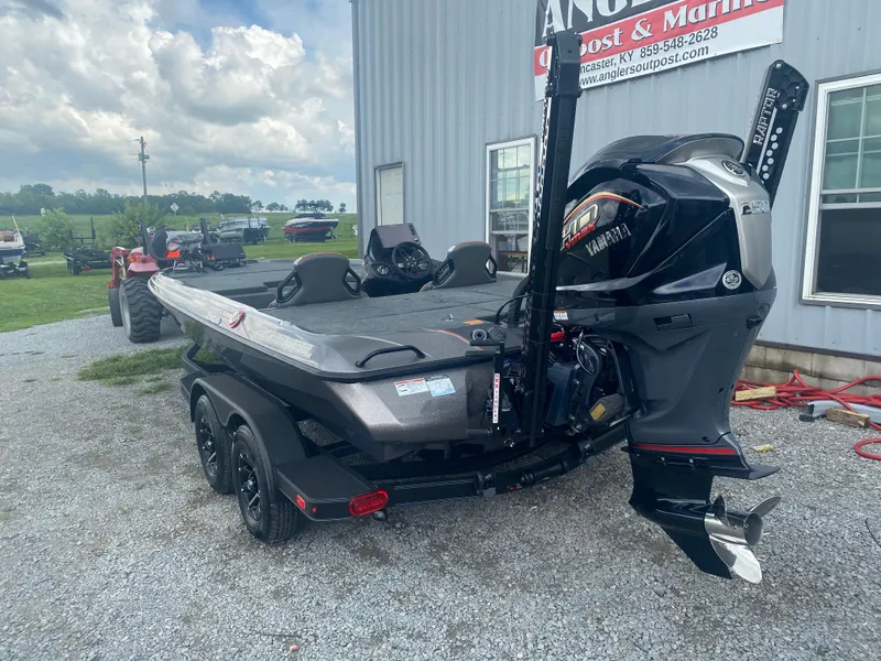Slide: The Image of 2026 Skeeter ZXE 21 boat with Yamaha engine, parked outside Angler's Outpost & Marine. - 8