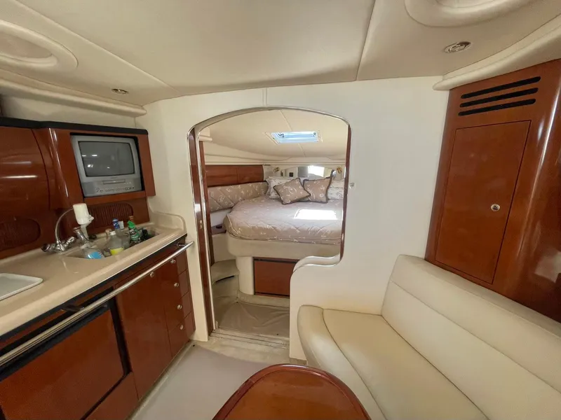 Slide: The Image of Luxurious interior of 2003 Sea Ray 360 Sundancer yacht with cozy seating and elegant wood finishes. - 17