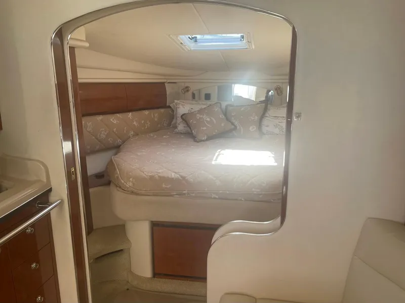 Slide: The Image of Luxurious cabin interior of 2003 Sea Ray 360 Sundancer yacht with cozy bedding. - 18