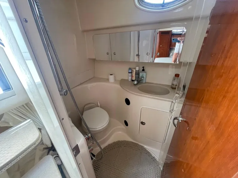 Slide: The Image of Bathroom interior of 2003 Sea Ray 360 Sundancer yacht, featuring sink and shower. - 28