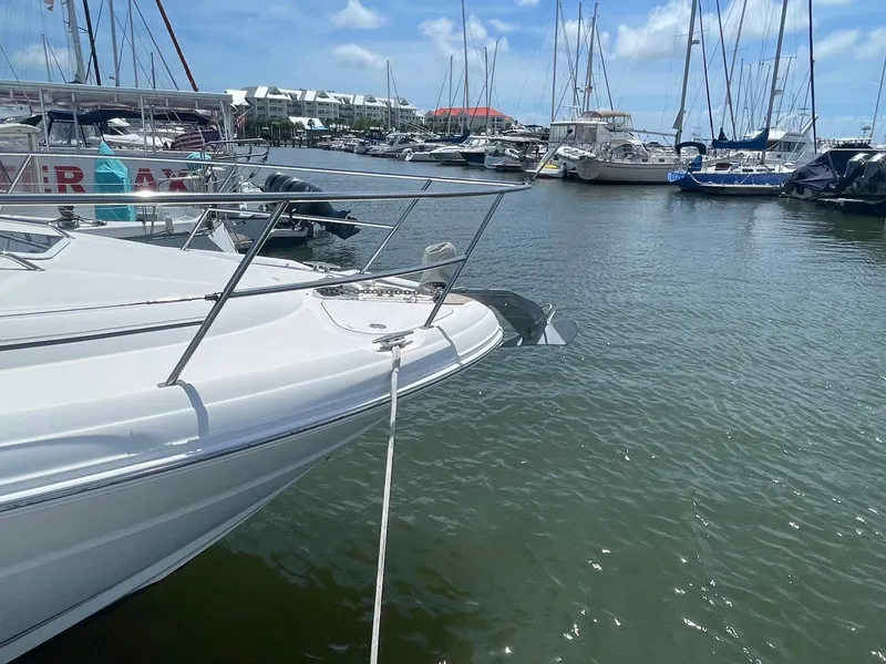 Slide: The Image of 2003 Sea Ray 360 Sundancer docked in a marina with other boats. - 30