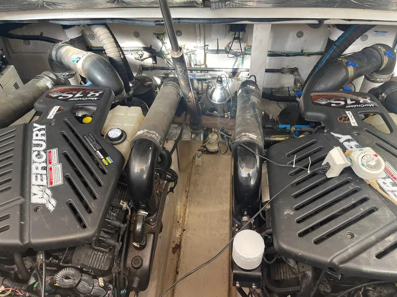Slide: The Image of Engine compartment of a 2003 Sea Ray 360 Sundancer with twin Mercury engines. - 33
