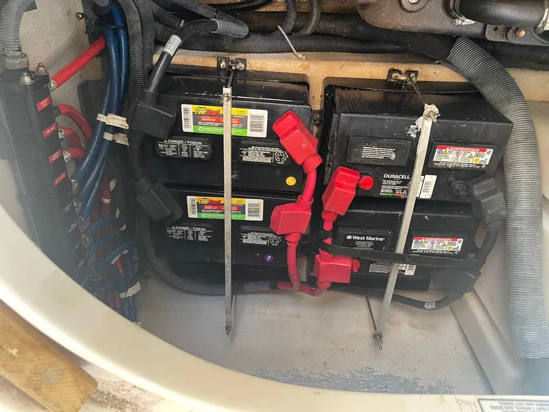 Slide: The Image of Battery compartment of a 2003 Sea Ray 360 Sundancer with multiple marine batteries. - 34