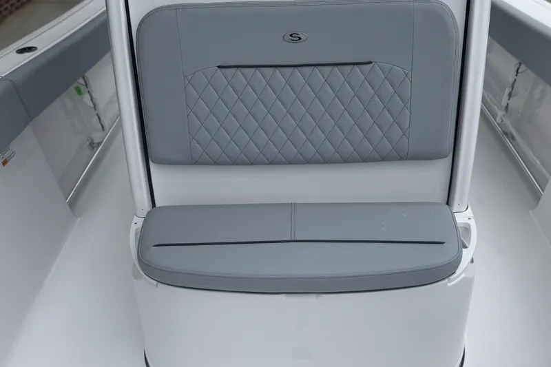 Slide: The Image of 2026 Sportsman Open 232 Center Console boat seat with quilted gray upholstery. - 14