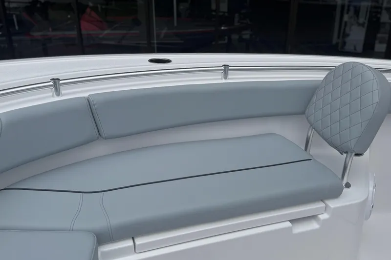 Slide: The Image of 2026 Sportsman Open 232 Center Console boat with gray cushioned seating. - 15