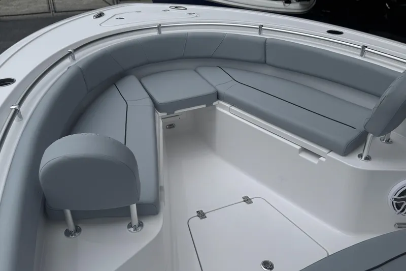 Slide: The Image of 2026 Sportsman Open 232 Center Console boat with gray cushioned seating. - 16