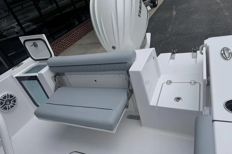 Slide: The Image of 2026 Sportsman Open 232 Center Console boat interior with seating and storage compartments. - 20