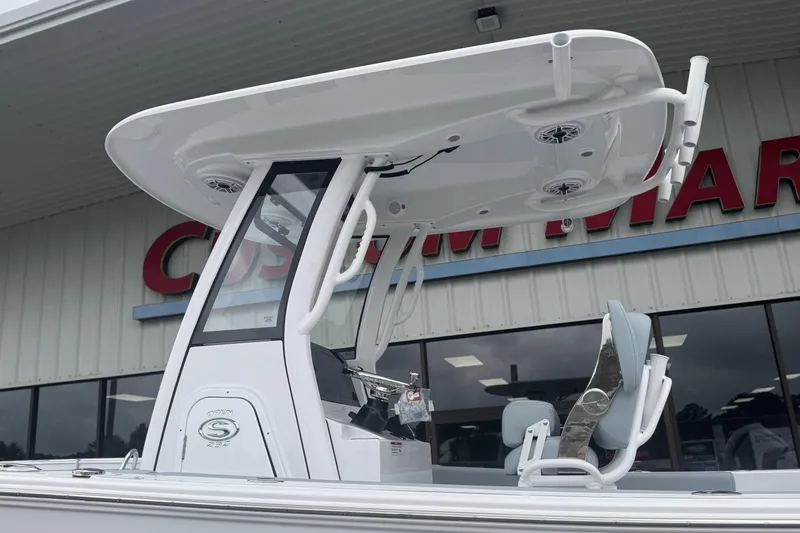 Slide: The Image of 2026 Sportsman Open 232 Center Console boat with T-top and seating. - 3