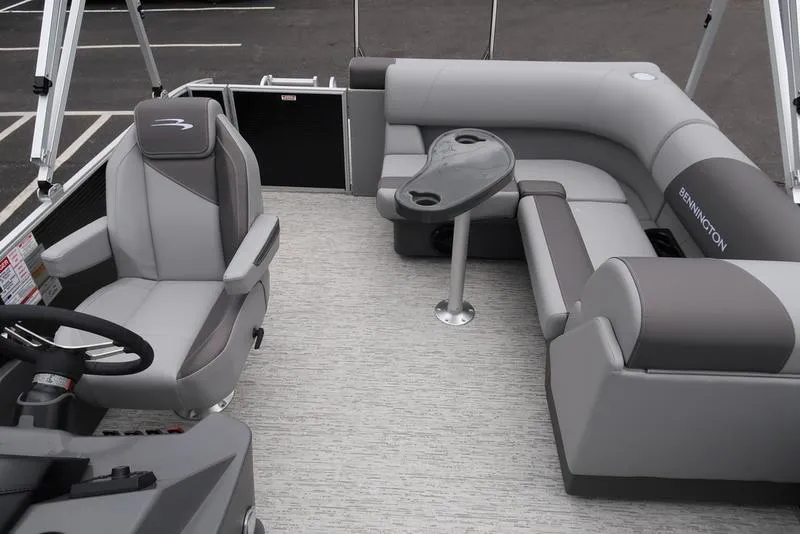 Slide: The Image of 2025 Bennington S L-Bench 21 SLJ pontoon boat interior with gray seating and steering console. - 13