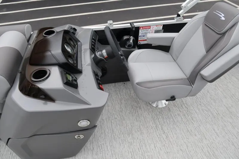 Slide: The Image of 2025 Bennington S L-Bench 21 SLJ boat interior with modern helm and seating. - 15