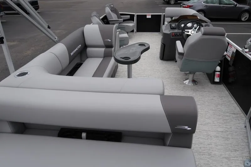 Slide: The Image of 2025 Bennington S L-Bench 21 SLJ pontoon boat interior with gray seating and helm. - 17