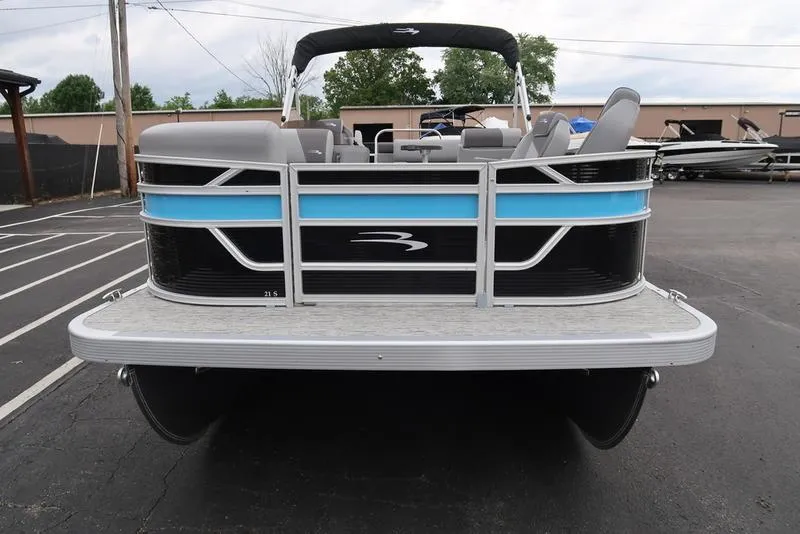 Slide: The Image of 2025 Bennington S L-Bench 21 SLJ pontoon boat, rear view in parking lot. - 2