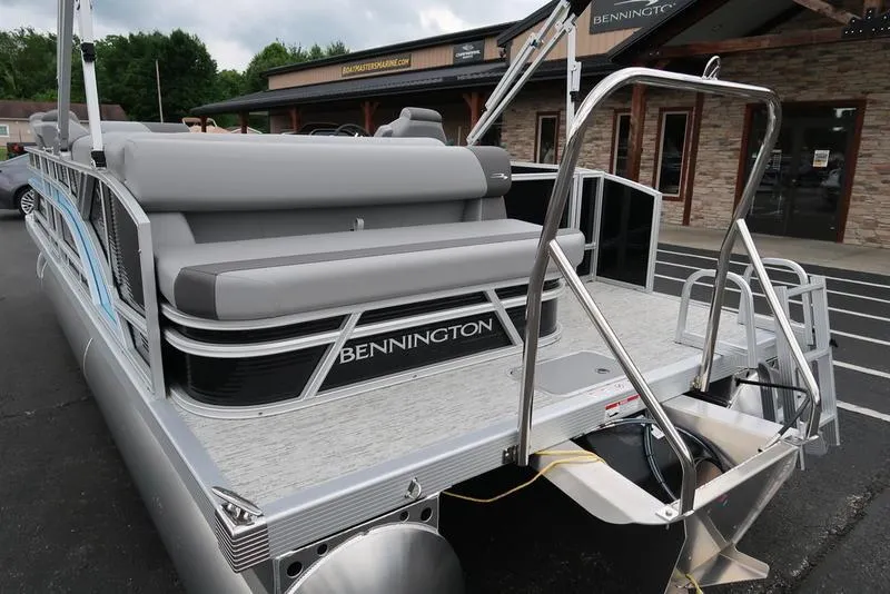 Slide: The Image of 2025 Bennington S L-Bench 21 SLJ pontoon boat with sleek design and comfortable seating. - 6