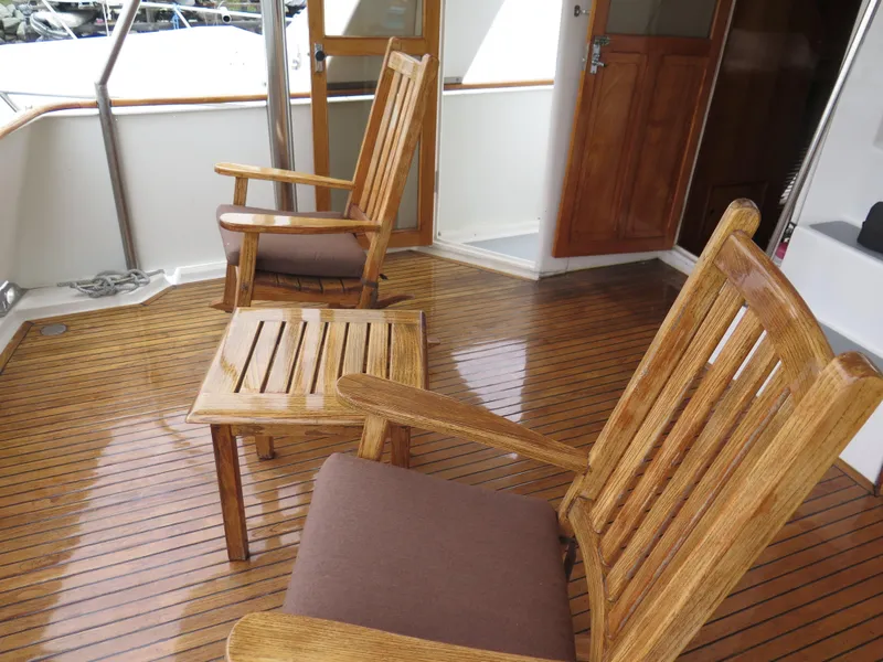 Slide: The Image of Wooden deck with chairs on a 1985 CHB Flush Deck Aftcabin boat. - 10