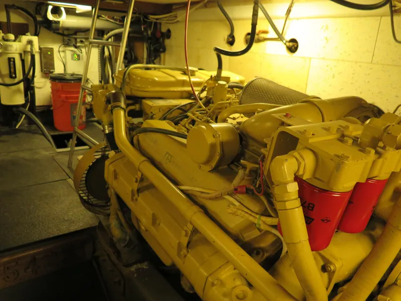Slide: The Image of Engine room of 1985 CHB Flush Deck Aftcabin with visible machinery and equipment. - 30