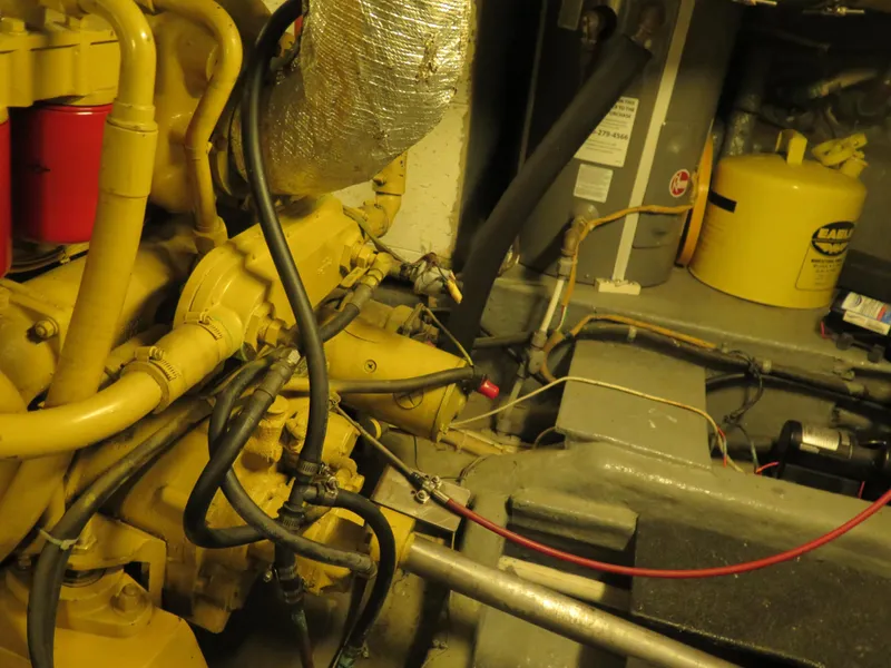 Slide: The Image of Engine room of 1985 CHB Flush Deck Aftcabin with visible machinery and components. - 31