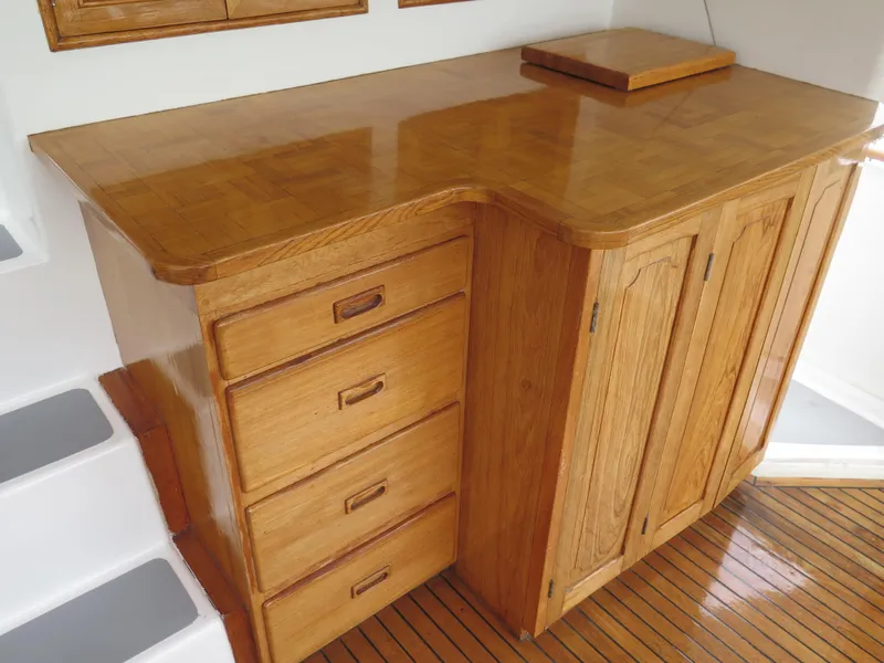 Slide: The Image of Wooden cabinetry in 1985 CHB Flush Deck Aftcabin, featuring drawers and cupboards. - 9