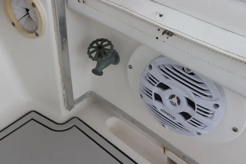 Slide: The Image of Kenwood speaker and valve on 2001 Fountain 25CC boat interior. - 18
