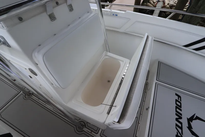 Slide: The Image of Open storage compartment on 2001 Fountain 25CC boat deck. - 21