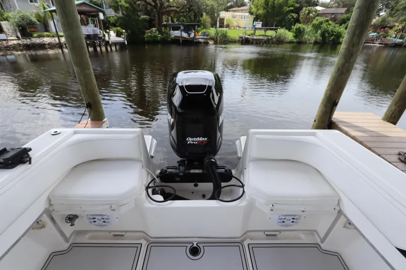 Slide: The Image of 2001 Fountain 25CC boat with OptiMax Pro XS engine on a calm river. - 6