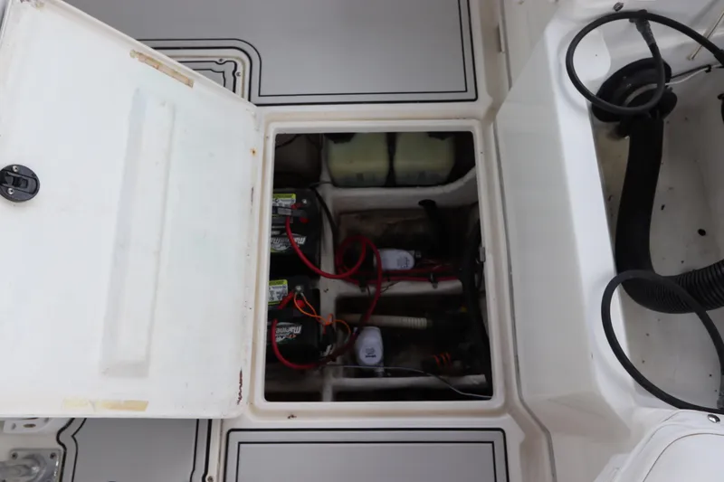 Slide: The Image of Open hatch of a 2001 Fountain 25CC boat showing battery compartment and wiring. - 9